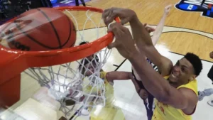 Basketball player finishing at the rim during a live game streaming live on USATVStream