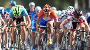 Road cyclists sprinting in a tight pack streaming live on USATVStream